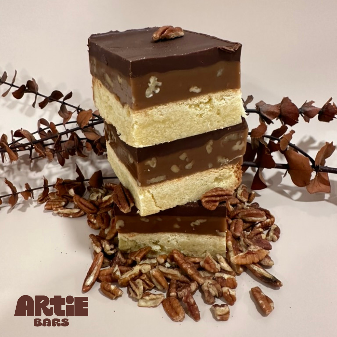 pecan dessert, toasted pecan bar, pecan shortbread, caramel pecan bar, chocolate ganache dessert, seasonal pecan treat, homemade baked goods, small batch desserts, buttery shortbread bars, pecan caramel chocolate, scratch-made dessert, Millionaire's shortbread, millionaire shortbread, handmade dessert, gourmet sweet snacks, gift, dessert gift, dessert, decadent chocolate treat, chocolate, ganache bars, baked goods, Artie Bars, treat yourself, small-batch sweets, scratch-made dessert, sweet treat gifts, bake