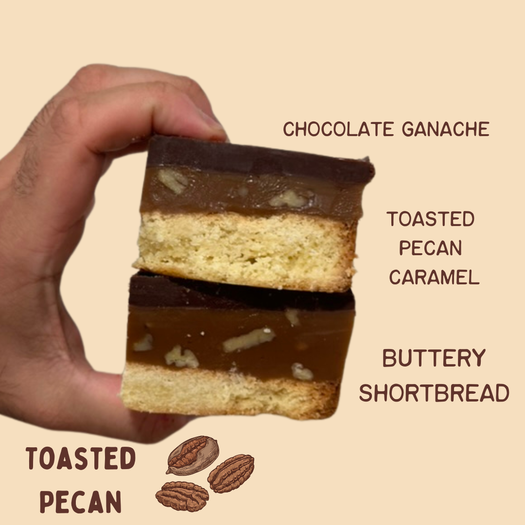pecan dessert, toasted pecan bar, pecan shortbread, caramel pecan bar, chocolate ganache dessert, seasonal pecan treat, homemade baked goods, small batch desserts, buttery shortbread bars, pecan caramel chocolate, scratch-made dessert, Millionaire's shortbread, millionaire shortbread, handmade dessert, gourmet sweet snacks, gift, dessert gift, dessert, decadent chocolate treat, chocolate, ganache bars, baked goods, Artie Bars, treat yourself, small-batch sweets, scratch-made dessert, sweet treat gifts, bake